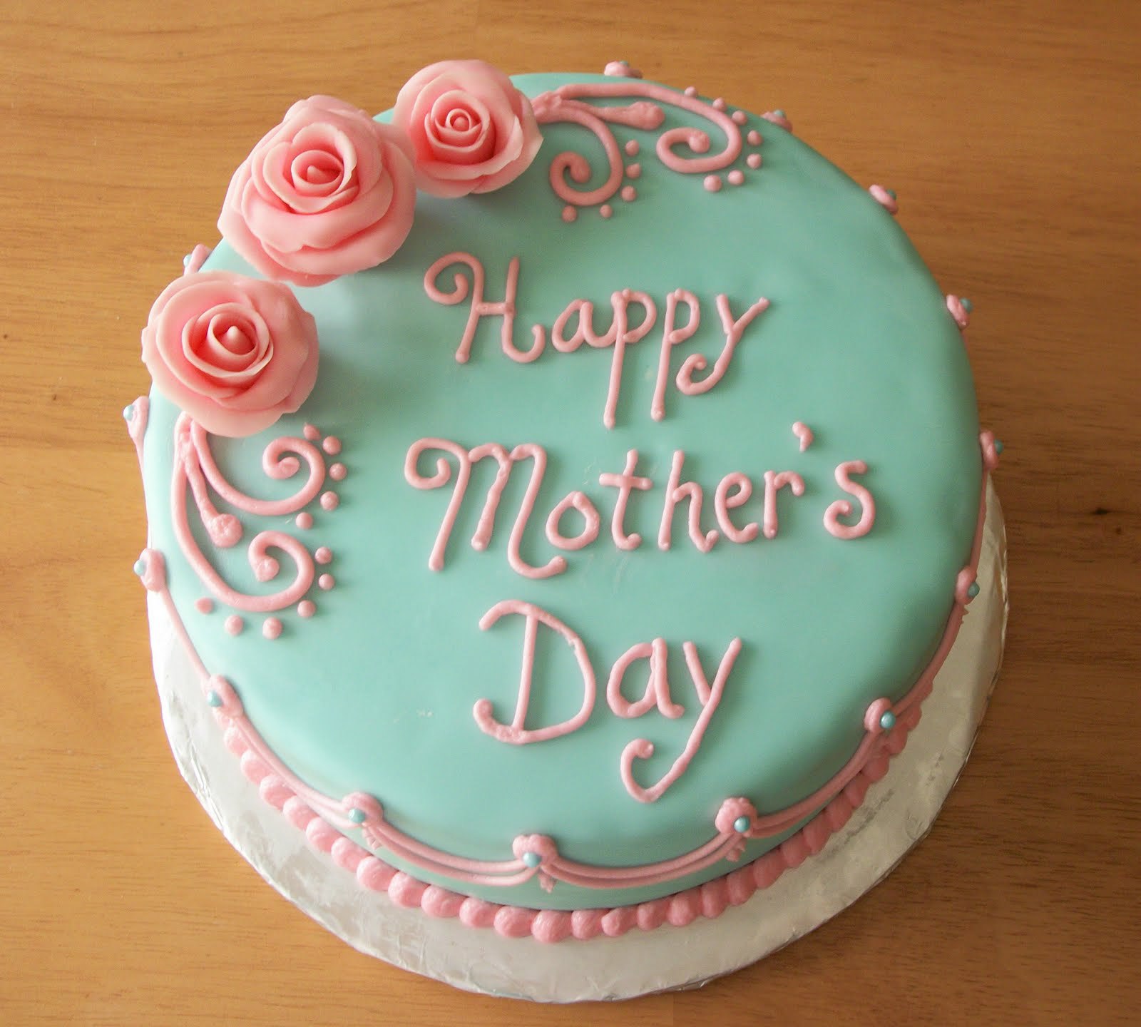 A Mother's Day cake with blue fondant and pink roses